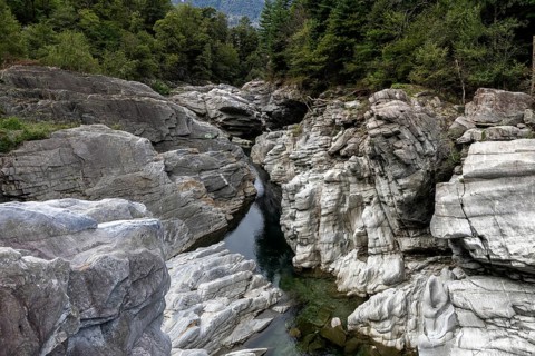 Rocks, granite rock formations in the Maggia River near Ponte Brolla, in the Maggia Valley, Valle