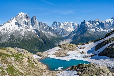 Mountain landscape with mountain lake Lac Blanc, mountain peaks, Aiguille Verte, Grandes Jorasses,