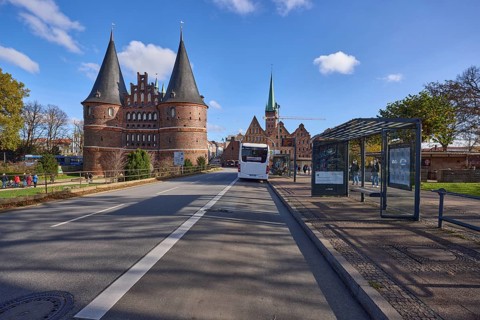 Lübeck Holstentor, bus stop Holstentorplatz with public bus, Hanseatic City of Lübeck, independent