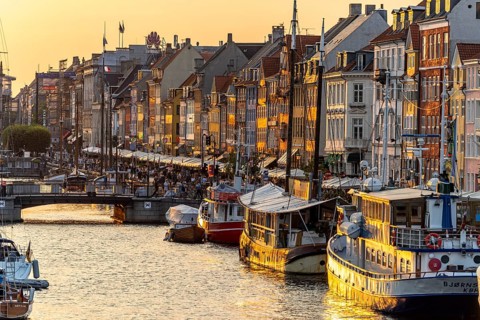 Colourful houses, restaurants and historic ships on the Nyhavn canal and harbour, Copenhagen,