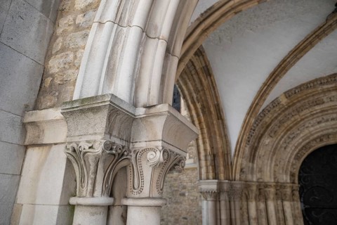 Entrance decorated with magnificent stone carvings to the medieval Temple Church, Anglican church