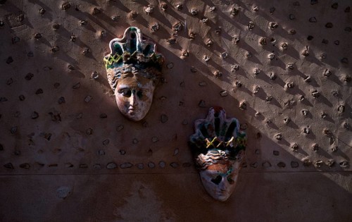 Masks on the wall, inner courtyard, Palacio del Rei Sanc, Valldemossa, Tramuntana Mountains, Serra