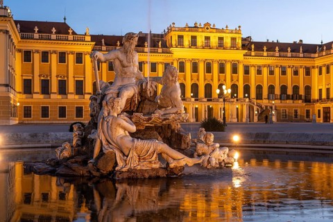 Fountain in the courtyard of honour at Schönbrunn Palace at dusk, UNESCO World Heritage Site in