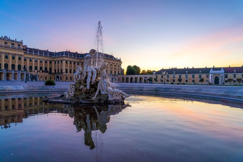 Fountain in the courtyard of honour at Schönbrunn Palace at dusk, UNESCO World Heritage Site in
