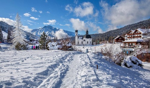 Seekirchl with artificial winter fir tree and Hocheder 2797m in winter, Seefeld, Seefeld Plateau,