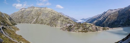 Grimselsee or Lake Grimsel with the historical Hotel Grimsel Hospiz near the Grimsel Pass in the