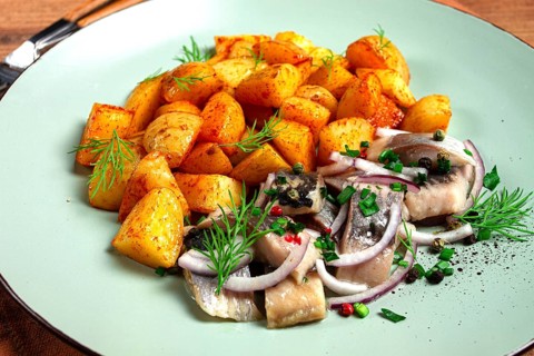 New potatoes, with pickled herring, and red onions, homemade, no people