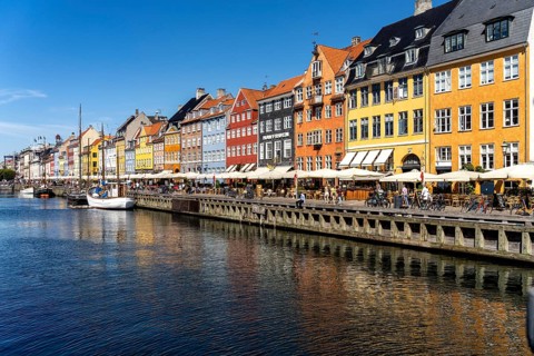 Colourful houses, restaurants and historic ships on the Nyhavn canal and harbour, Copenhagen,