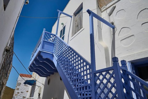 White buildings with blue staircase and clear sky, Chora, Astypalea, Dodecanese, Greek Islands,