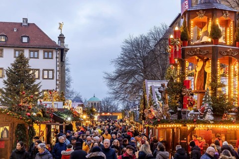 Stuttgart Christmas market at the blue hour. Christmas pyramid on Schillerplatz in front of the Old