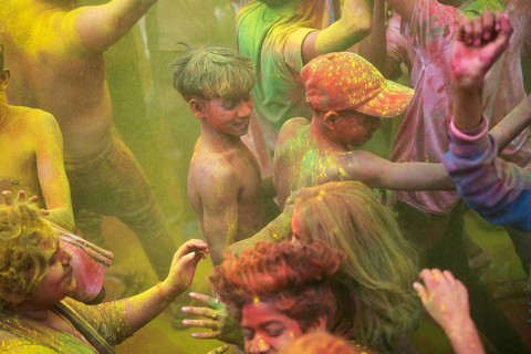 Revellers smear with Gulal or coloured powder and dance to play Holi, the Hindu spring festival of