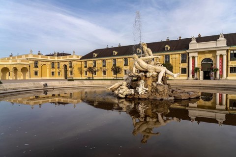 Fountain in the courtyard of honour at Schönbrunn Palace, UNESCO World Heritage Site in Vienna,