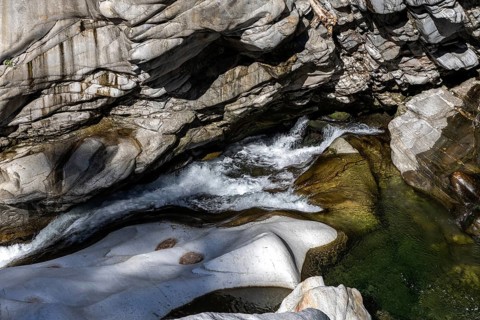 Rocks, granite rock formations in the Maggia River near Ponte Brolla, in the Maggia Valley, Valle