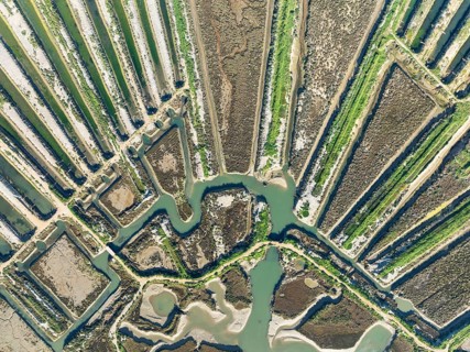 Saline ponds at the salt works of Isla Cristina. Aerial view. Drone shot. Huelva province,