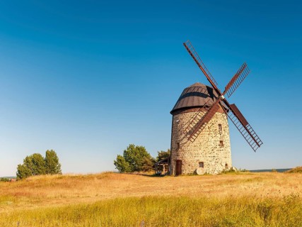 The tower windmill of Warnstedt in the evening light under a blue sky, Teufelsmühle, Thale,