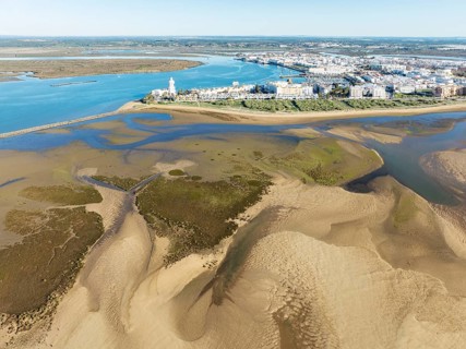 The town of Isla Cristina adjacent to the Lago de la Gaviota (lake of the seagull) at low tide.