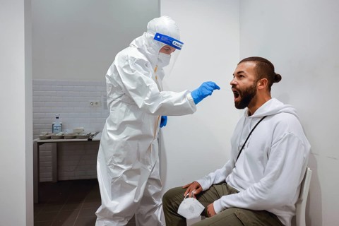 Cologne, North Rhine-Westphalia, Germany - Covid rapid test at the Medicare test centre, throat