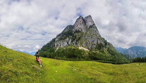 Hiker on the Schartenalm with a view of the Sparber, Osterhorn group, Salzkammergut, Salzburg