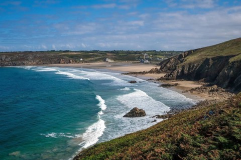 Plogoff, Brittany, France - Hiking trail from Pointe du Raz to Pointe du Van, behind the bay with