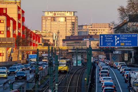 The A40 motorway, Ruhrschnellweg, in the city passage in Essen, light rail line U18, evening