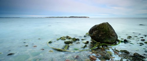 Coastal landscape, erratic boulder and old rope, Mönchgut peninsula, Southeast Rügen biosphere