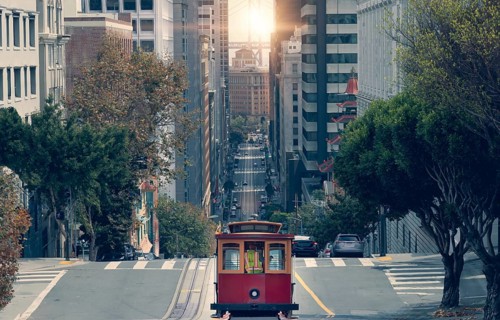 San Francisco, California street and cable cars that connect financial district and upper town