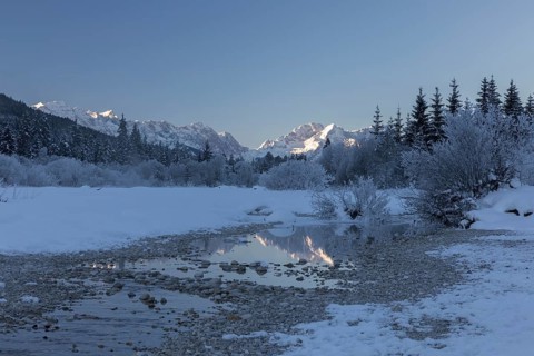 Isar valley in winter at temperatures of minus 18 degrees Celsius. Snow covered landscape with the