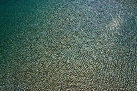 Drone shot, water surface at the beach and bay of Balos, Gramvousa peninsula, Kolimbari, West