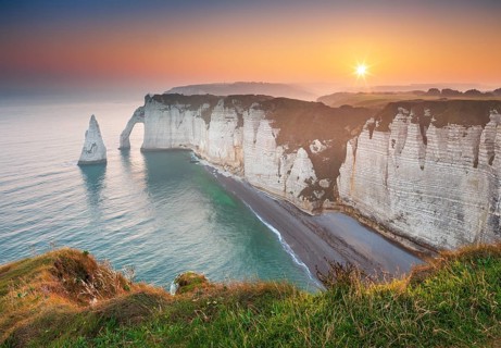 The coast of Etretat (Étretat) at sunrise, cliffs with Porte d'Aval and Aiguille rock needle,
