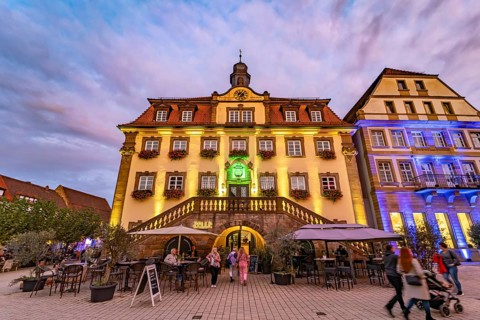 The colourfully illuminated town hall for the Shopping Lights event in Neckarsulm,