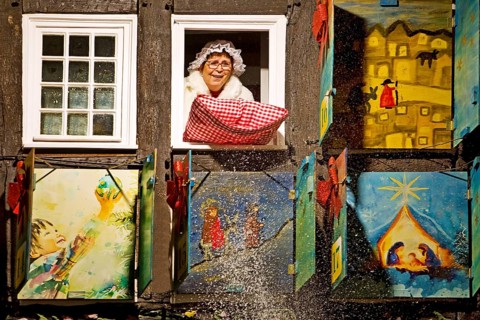 Mrs Holle shakes out her pillow at the big Advent calendar at the Old Town Hall, Nostalgic