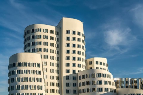 The Neue Zollhof with the Gehry buildings by architect and designer Frank Gehry in the Media