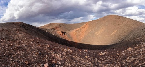 A dried-up volcano with a crater-shaped depression and colourful hills, Argentina, Volcanoes, Lava
