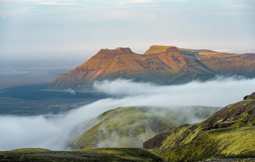 Fog between mountains, moss-covered volcanic mountain landscape, at sunset, Pakgil, Iceland, Europe
