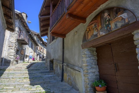 Pictures on the house walls characterise the narrow streets with old houses in the village,