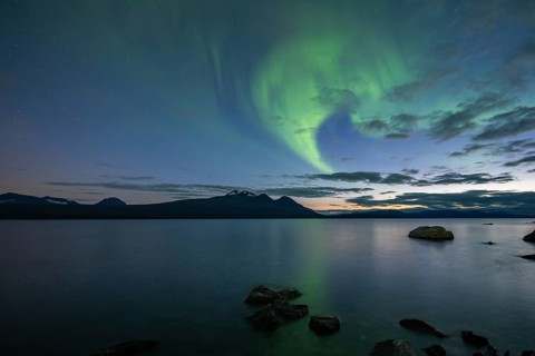 Northern Lights over Lake Akkajaure and Akka mountain range, Stora Sjöfallet National Park,