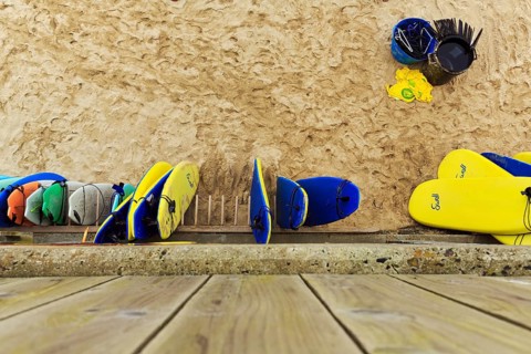 Surfboards leaning against a wall on the beach, surf school, view from above, St. Ives, England,