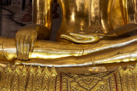 Golden Buddha statue, Phra Buddha Trilokachet, surrounded by exquisite murals, interior view of the