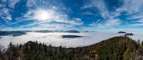 Drone shot, view from Schwarzenberg to a sea of fog in the Salzach valley, Osterhorn group,