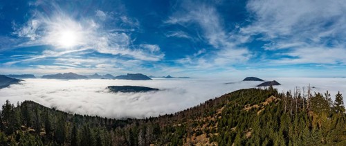Drone shot, view from Schwarzenberg to a sea of fog in the Salzach valley, Osterhorn group,