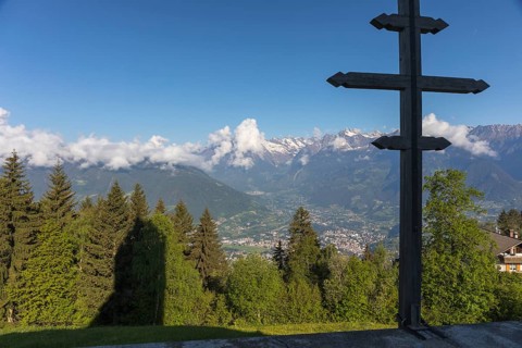 Church St. Kathrein, 39010 Hafling, Italy with the city of Meran in the background. The church is