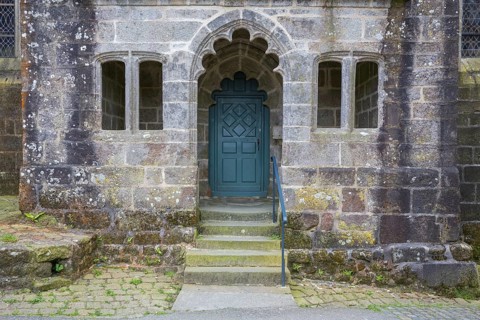 Side entrance of St Ronan church in Locronan village, Finistère department of Brittany in