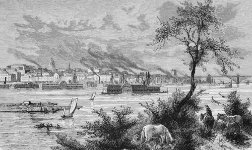 City view of St. Louis in the state of Missouri on the Mississippi River, smoking chimneys, paddle
