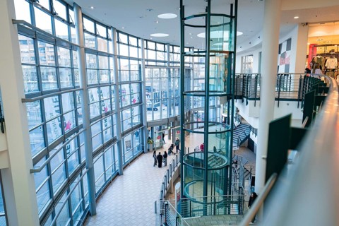 Bright, modern shopping centre with glass lift and large window front, Sterncenter Sindelfingen,