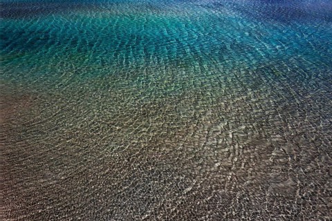 Drone shot, glittering water surface on the beach of Elafonisi, west coast, Crete, Greece, Europe