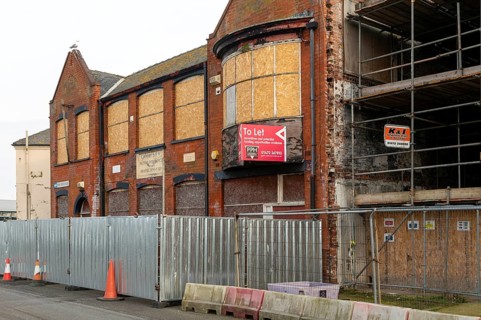 To Let estate agent sign on empty disused property in Grimsby docks, north east Lincolnshire,