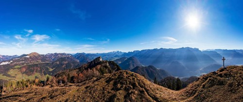 Drone shot, summit cross on the Schwarzer Berg with a view of the Lammertal with Dachstein massif