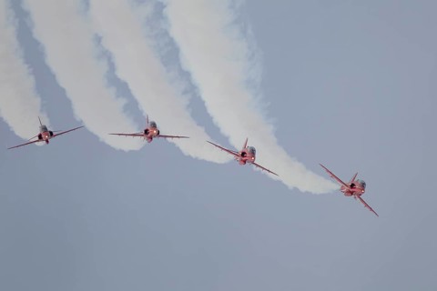 BAE Systems Hawk four aircraft of the RAF Royal air force Red Arrows display team flying, England,