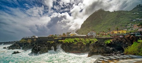 High waves on the rocks of Porto Moniz, surf on the Atlantic Ocean, storm, clouds, Porto Moniz,