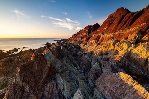 Colourful rocks on the coast, Varanger, Barents Sea, Finnmark, Norway, Europe
